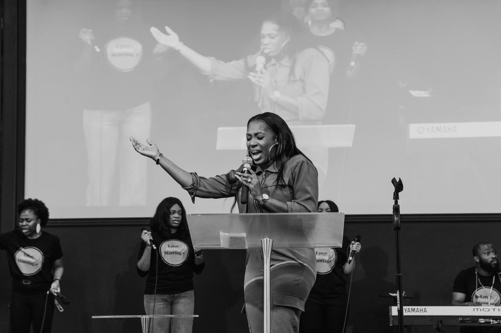 Pastor Nikki Okedele speaking passionately